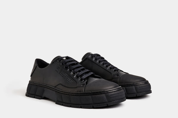 1968 Vegan basketball low-top sneaker made from vegan leather in black apple shown from the side