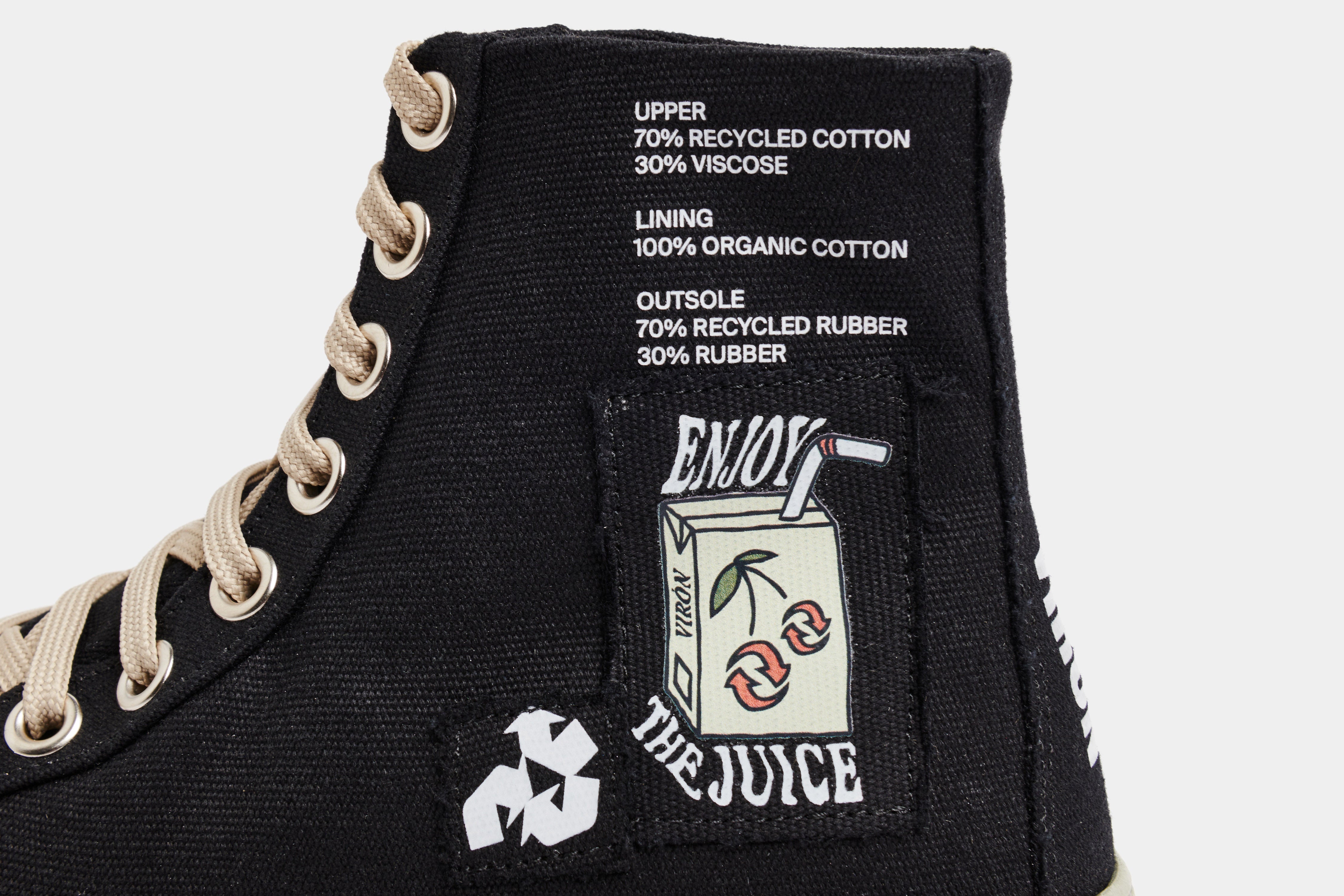 1982 Vegan high top sneaker made from recycled cotton in Black with green sole shown close up