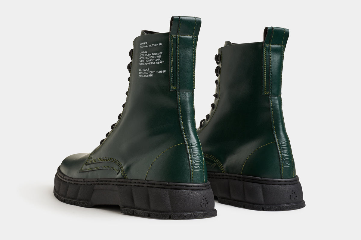 vegan leather 1992 combat boot in dark green from the back