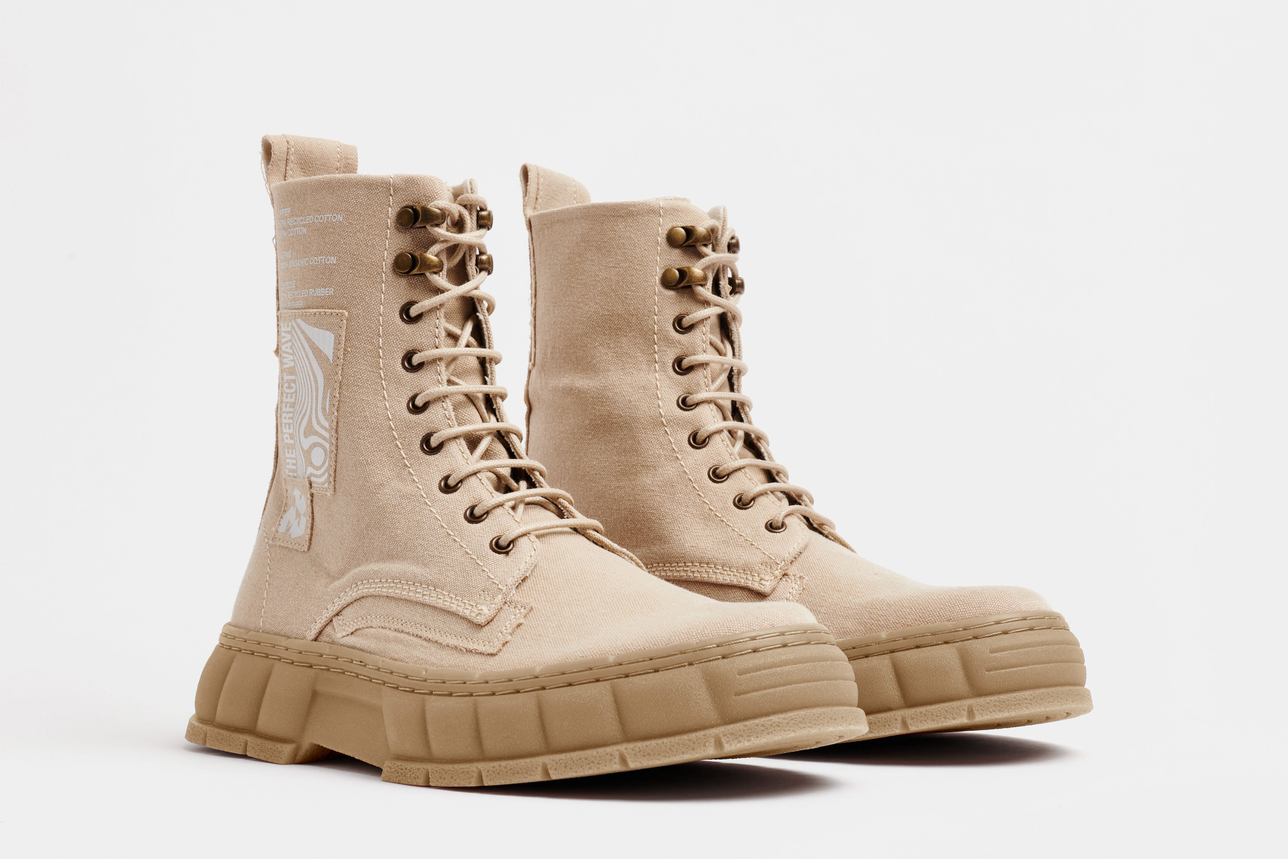 1992 Vegan combat boot out of recycled surplus army tents in sand shown from the front