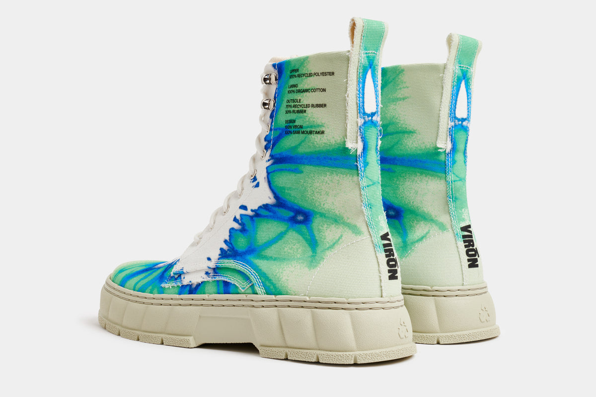 1992 Vegan combat boot out of recycled PET in green, blue and white shown from the back