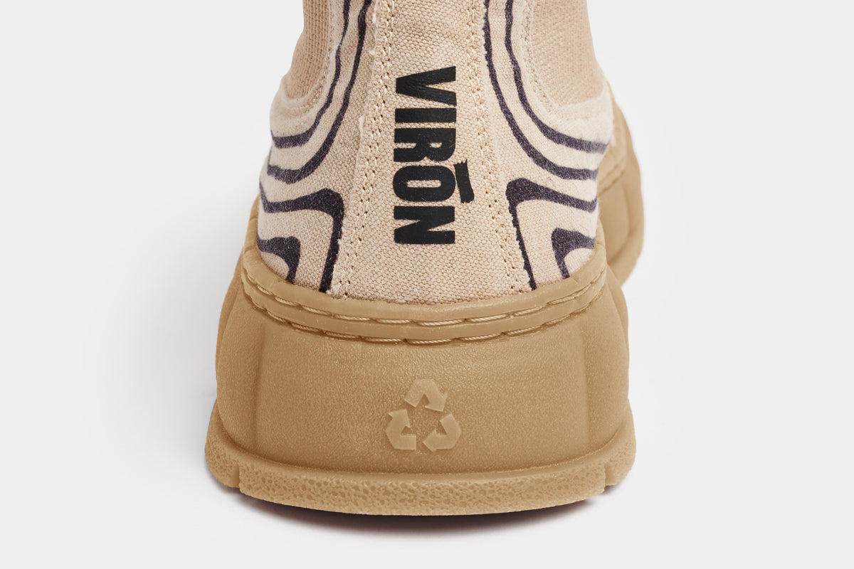 1997 Vegan Chelsea boot made from recycled cotton in beige with line elements shown close up