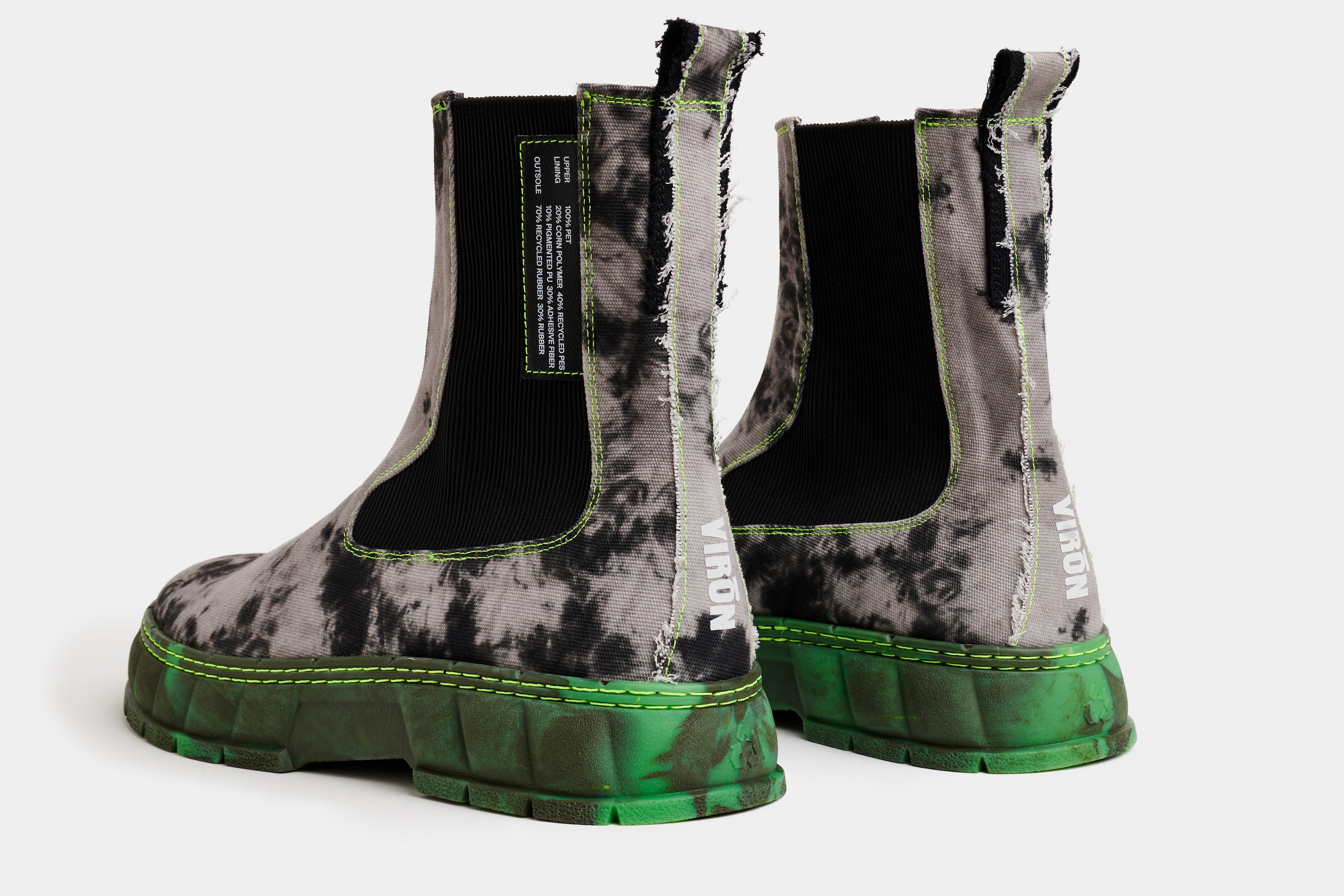 1997 Vegan Chelsea boot out of recycled PET in grey Neon Fog with green sole shown from the back