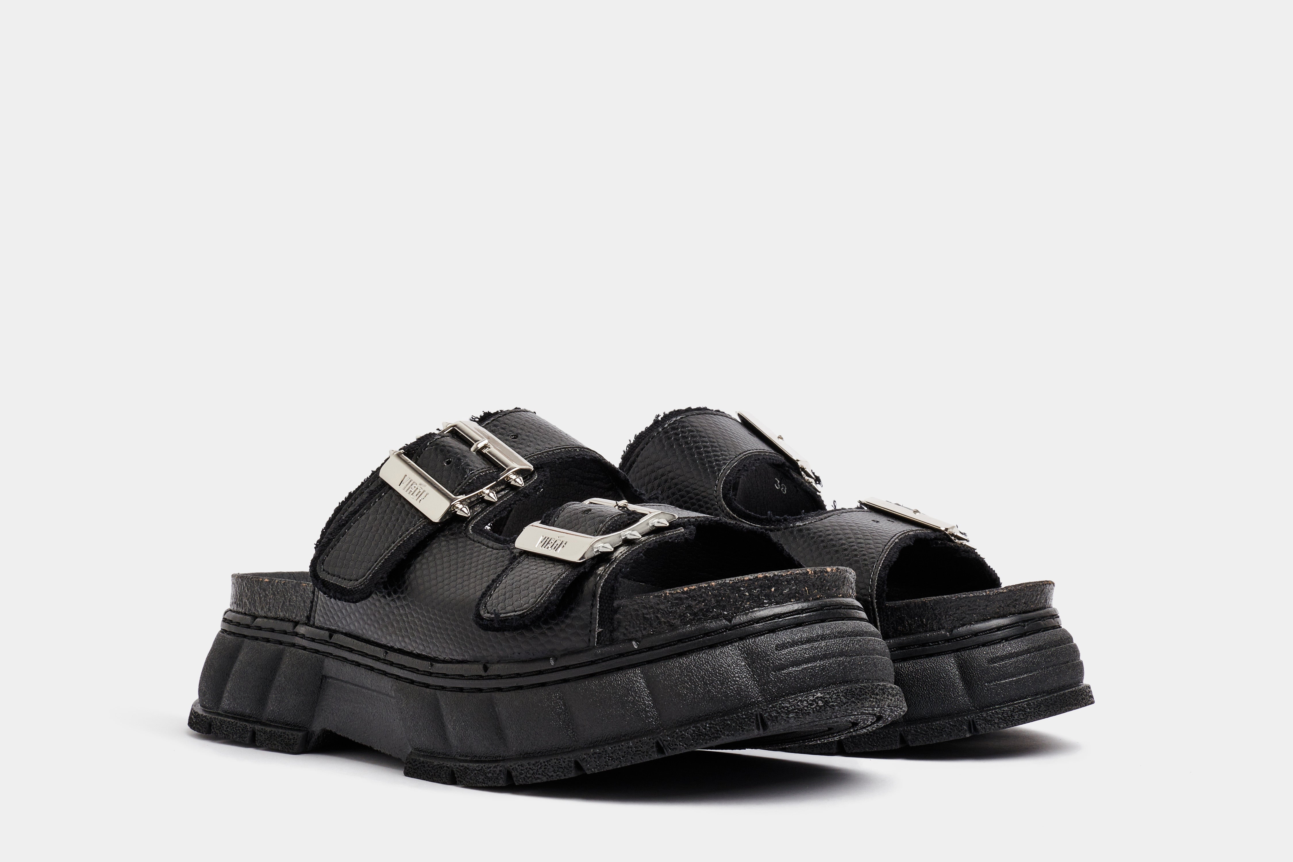 2018 Vegan black platform sandal made from apple leather in snake optic shown from the front