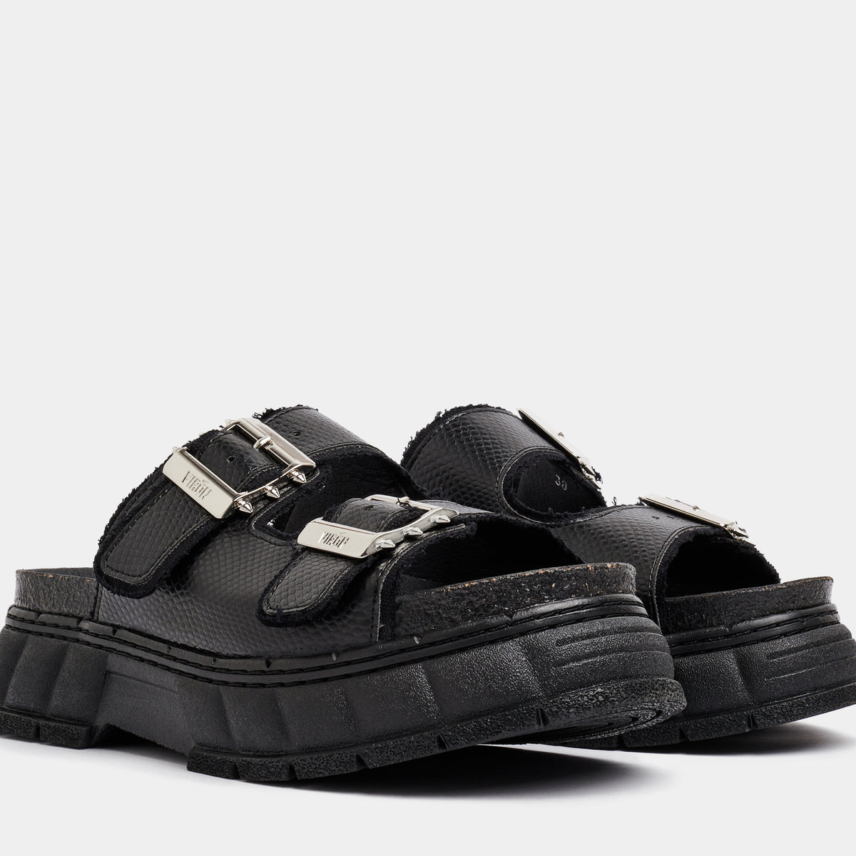 2018 Vegan black platform sandal made from apple leather in snake optic shown from the front