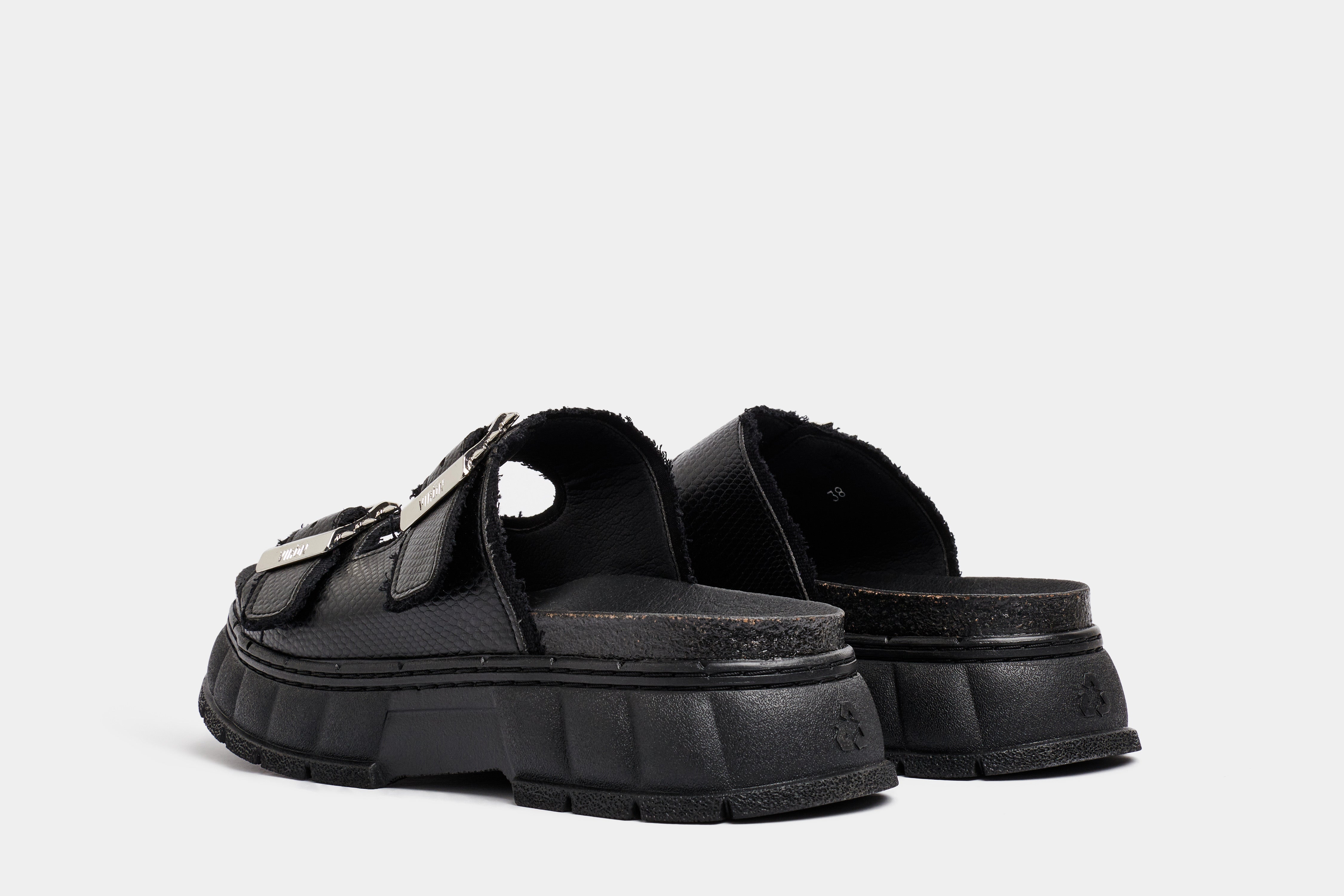 2018 Vegan black platform sandal made from apple leather in snake optic shown from the back