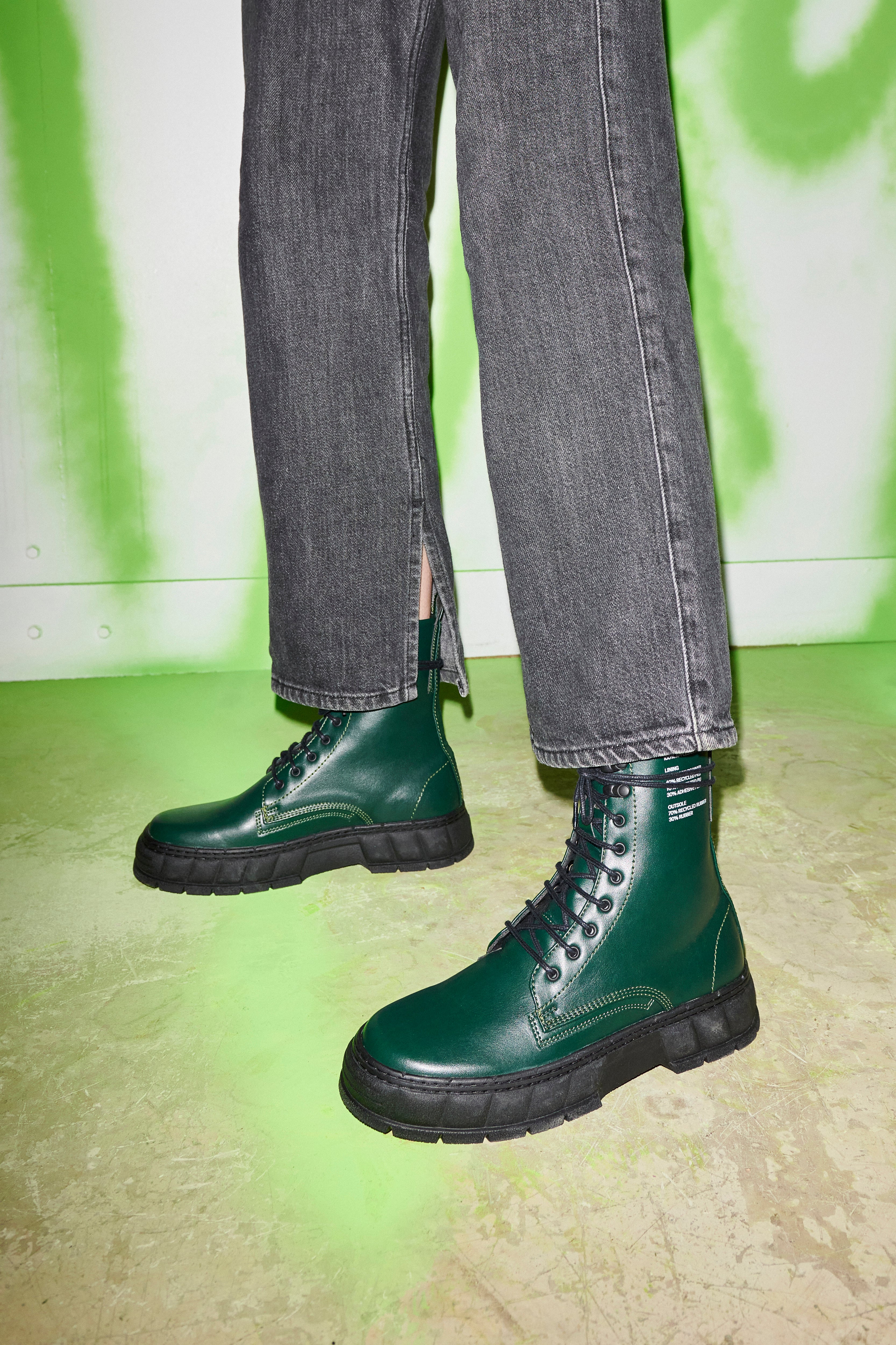 1992 Vegan combat boot made from vegan leather in Forest Apple shown on feet