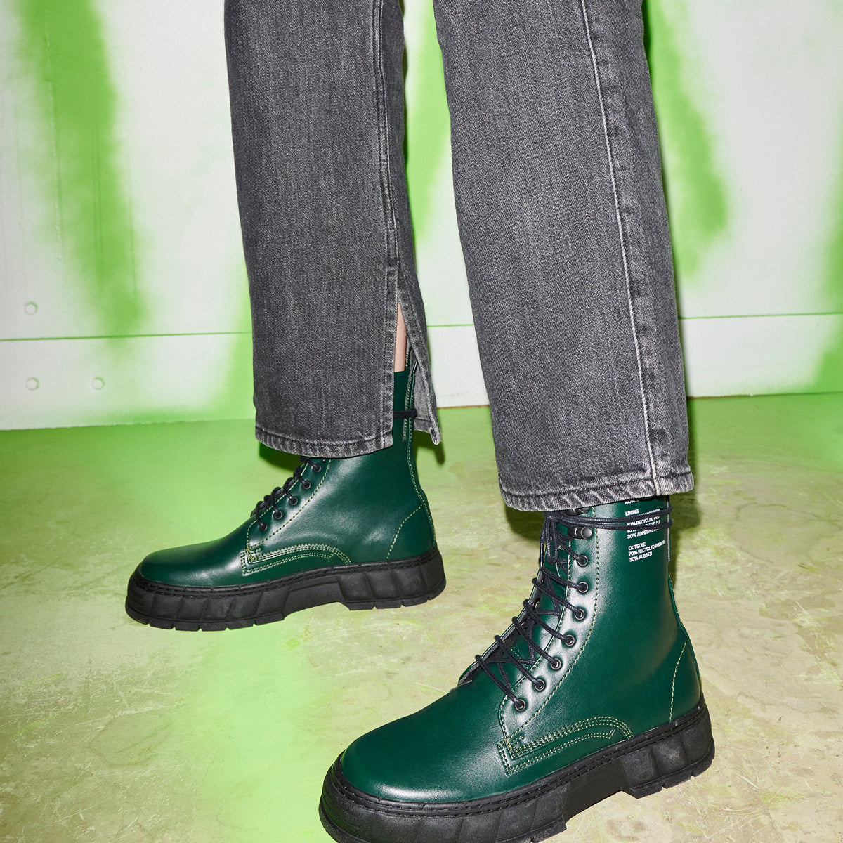 1992 Vegan combat boot made from vegan leather in Forest Apple shown on feet